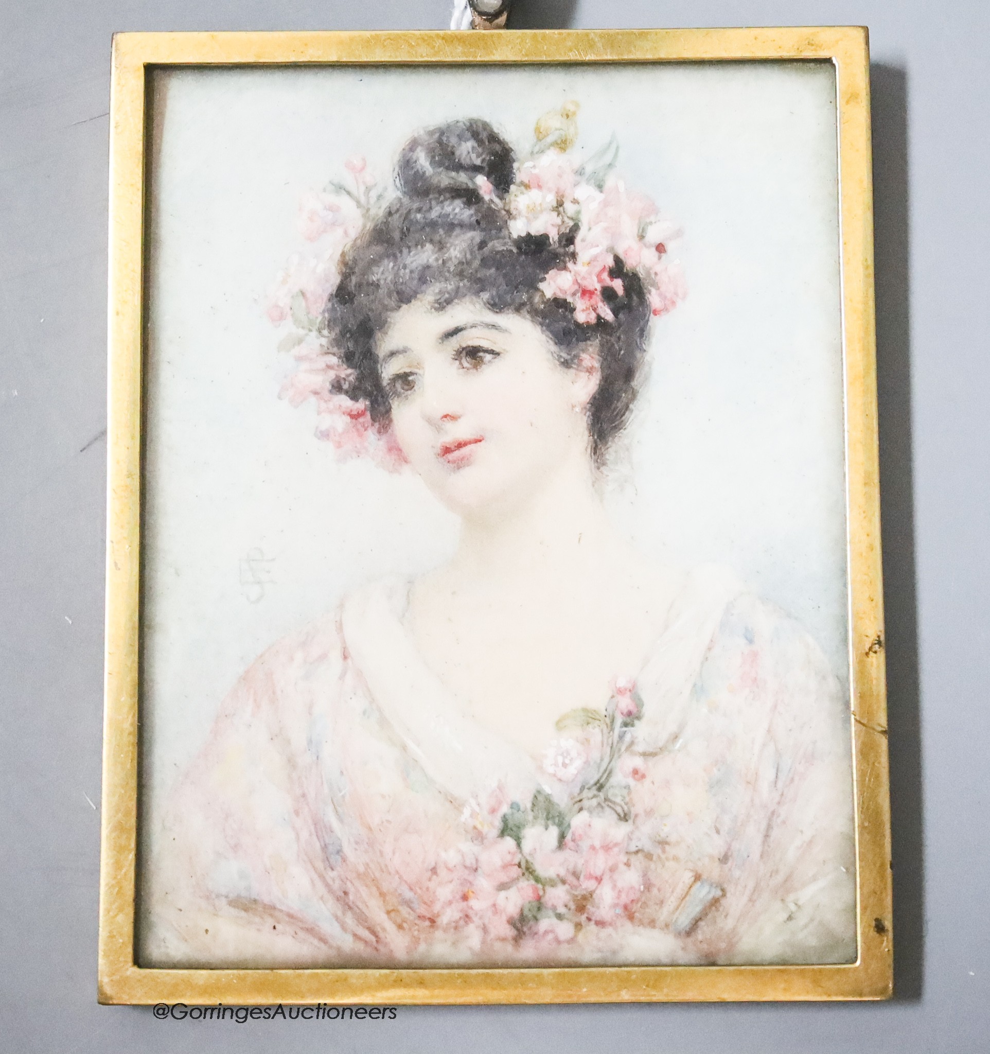 A brass cased miniature watercolour of a lady, monogrammed, 9 x 7cm